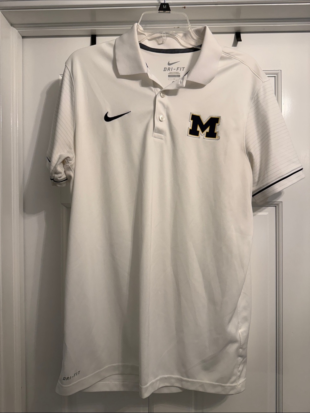 Nike White Dri-FIT Polo with Black and Gold 'M' Logo